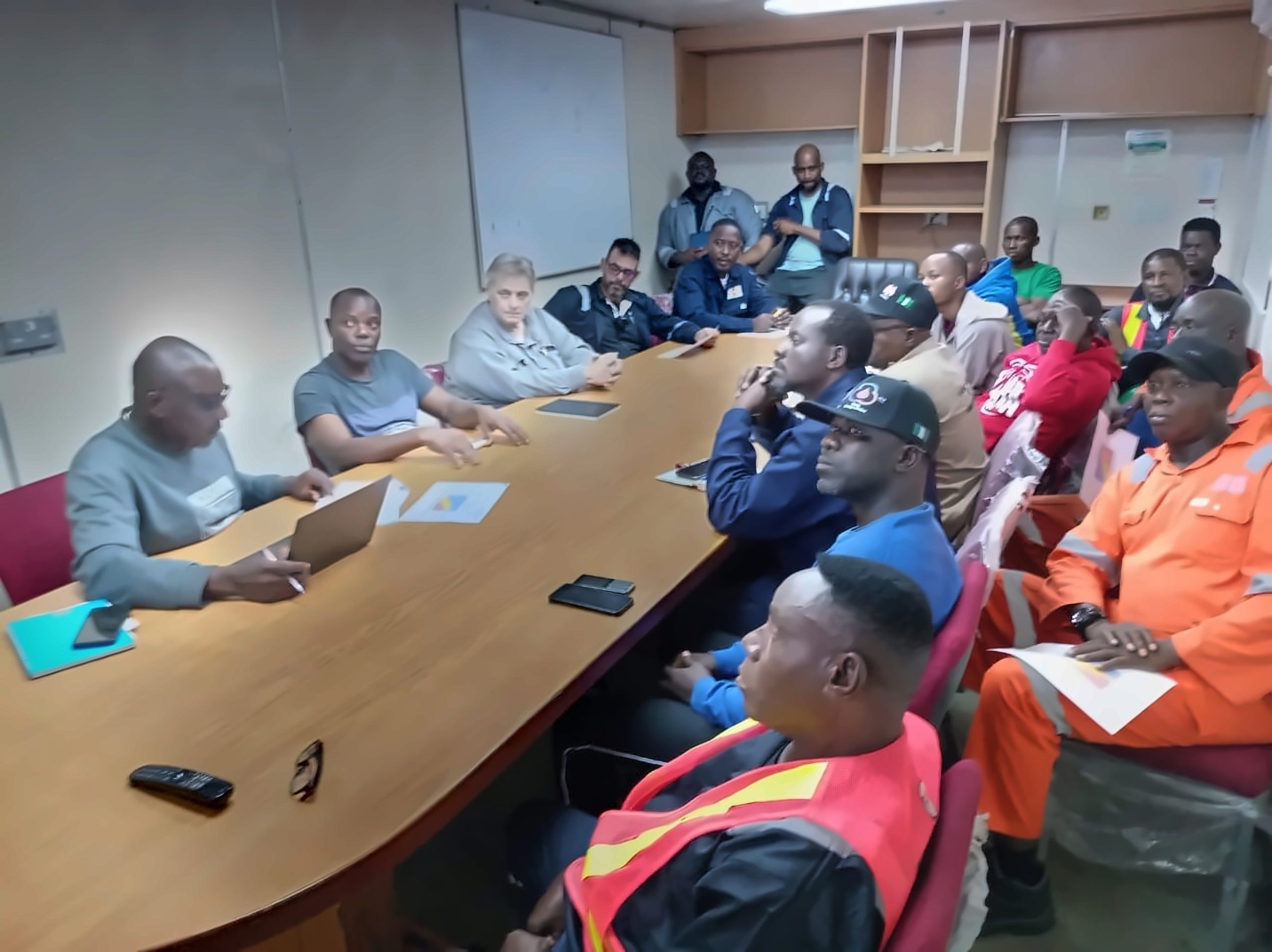 Dive Marine crew and project team during a pre-dive safety briefing onboard a vessel
